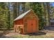 Rustic log storage shed with stacked firewood near towering trees, perfect for storing outdoor essentials at 5724 Highway 9, Breckenridge, CO 80424