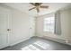 Bedroom showcasing two doors and plenty of natural light from the window at 2858 Jasmine St, Denver, CO 80207
