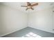 A large bedroom featuring a ceiling fan and gray flooring at 2858 Jasmine St, Denver, CO 80207