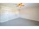 A bright, spacious bedroom featuring a ceiling fan and light-colored walls at 2858 Jasmine St, Denver, CO 80207