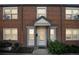 Well-lit front exterior of red brick apartment complex with a covered front entrance at 2858 Jasmine St, Denver, CO 80207