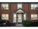 Front exterior of red brick apartment complex with covered front entrance, with lots of windows at 2858 Jasmine St, Denver, CO 80207