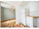 Compact kitchen featuring tiled floors, white refrigerator and light wood countertops at 2858 Jasmine St, Denver, CO 80207