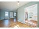 Sunlit living room showcases an open floorplan and access to the kitchen with tile floors at 2858 Jasmine St, Denver, CO 80207