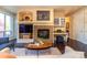 Comfortable living room with fireplace, bar, hardwood floors, and view at 1735 N Ogden St # 106, Denver, CO 80218