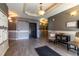 A well decorated lobby with gray walls, mailboxes, table, chairs, a black rug, lights, and an elevator at 1735 N Ogden St # 106, Denver, CO 80218