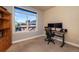 Home office with hardwood floors, large window, and desk with dual monitors at 1735 N Ogden St # 106, Denver, CO 80218
