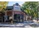 Inviting brick building featuring a kitchen and bar with ample outdoor seating and modern architectural design at 1735 N Ogden St # 106, Denver, CO 80218