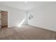 Neutral bedroom featuring neutral carpet, a single window, and closet at 8616 Pennycress Dr, Littleton, CO 80125