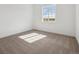 Bedroom featuring neutral carpet, and a large window providing natural light at 8616 Pennycress Dr, Littleton, CO 80125