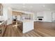 Modern kitchen featuring an island with stainless steel appliances, sleek white counter tops, and breakfast bar at 8616 Pennycress Dr, Littleton, CO 80125