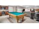 Basement featuring a pool table, wet bar with mini-fridge, and cozy seating area at 3234 El Charro Pt, Castle Rock, CO 80108