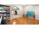 Basement featuring a bookshelf filled with games, hardwood flooring, and a game area at 3234 El Charro Pt, Castle Rock, CO 80108