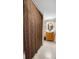Bathroom with a wooden vanity, an oval mirror, and a textured shower curtain at 3234 El Charro Pt, Castle Rock, CO 80108