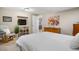 Calm bedroom with a dresser, mounted TV, and a rocking chair for ultimate relaxation at 3234 El Charro Pt, Castle Rock, CO 80108