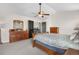 Bedroom featuring wood furniture and a ceiling fan at 3234 El Charro Pt, Castle Rock, CO 80108