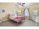 Cheerful ' bedroom featuring colorful wall decals, pink bed frame, and vaulted ceiling at 3234 El Charro Pt, Castle Rock, CO 80108