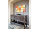 Inviting entryway with a wooden console table, decorative wall art, and tile flooring at 3234 El Charro Pt, Castle Rock, CO 80108