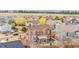 Scenic aerial view of a two-story residence with a well-manicured lawn and a cozy backyard space at 3234 El Charro Pt, Castle Rock, CO 80108
