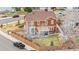 Aerial view of a well-maintained two-story home, with landscaping, and a fenced backyard oasis at 3234 El Charro Pt, Castle Rock, CO 80108