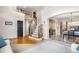Grand entrance featuring a curved staircase, wood floors, and an arched doorway leading to the dining room at 3234 El Charro Pt, Castle Rock, CO 80108