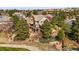 Spacious home with lush landscaping, a private deck, patio, and a built-in firepit for outdoor entertaining at 6462 S Versailles Ct, Aurora, CO 80016
