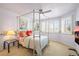 Charming bedroom featuring bright light and a bed with lovely, decorative pillows at 6462 S Versailles Ct, Aurora, CO 80016