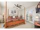 Bright bedroom with a four-poster bed and access to the outdoor area at 6462 S Versailles Ct, Aurora, CO 80016