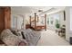 Spacious main bedroom featuring a four-poster bed, sitting area and tray ceiling at 6462 S Versailles Ct, Aurora, CO 80016