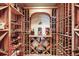 Custom wine cellar with ample storage, shelving and center display at 6462 S Versailles Ct, Aurora, CO 80016