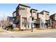 Modern townhome exterior showcasing balconies, brick accents, and contemporary architectural design at 10305 Martin Luther King Blvd, Denver, CO 80238