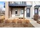 Cozy front porch with decorative swing, stylish planters, and welcoming entrance to the modern townhome at 10305 Martin Luther King Blvd, Denver, CO 80238