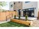 Modern home featuring a manicured backyard with a patio at 425 S Pearl St, Denver, CO 80209