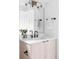 Modern bathroom vanity with light wood cabinets, quartz countertop, and black fixtures at 425 S Pearl St, Denver, CO 80209