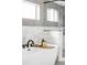 Soaking tub features elegant black fixtures, marble accents, and a modern design at 425 S Pearl St, Denver, CO 80209