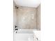 Clean bathroom features tub with white subway tile surround and modern fixtures at 425 S Pearl St, Denver, CO 80209