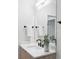 Modern bathroom vanity with light wood cabinets, quartz countertop, and black fixtures at 425 S Pearl St, Denver, CO 80209
