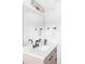 Modern bathroom with double sinks, stylish fixtures, and a large mirror, offering a contemporary and functional design at 425 S Pearl St, Denver, CO 80209