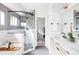 Modern bathroom boasts a luxurious glass shower, soaking tub, and stylish fixtures at 425 S Pearl St, Denver, CO 80209
