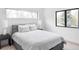 Cozy bedroom with a comfortable bed, neutral decor, and natural light, creating a serene and inviting space at 425 S Pearl St, Denver, CO 80209