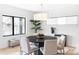 Elegant dining room with a round table, stylish chairs, and natural light from large windows at 425 S Pearl St, Denver, CO 80209