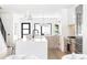 Open kitchen with a large island, modern appliances, and view into living spaces at 425 S Pearl St, Denver, CO 80209