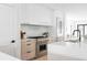 Well-lit kitchen features stainless steel appliances, ample counter space and modern cabinetry at 425 S Pearl St, Denver, CO 80209