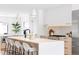 Modern kitchen with a waterfall island, stainless steel appliances, and barstool seating at 425 S Pearl St, Denver, CO 80209