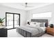 Bright main bedroom features a modern ceiling fan, large sliding door, and designer decor at 425 S Pearl St, Denver, CO 80209