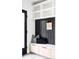 Stylish mudroom features a built-in bench, storage cabinets, and a black vertical panel accent wall at 425 S Pearl St, Denver, CO 80209