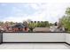 City views from the roof deck, showcasing neighboring homes and distant buildings against a blue sky at 425 S Pearl St, Denver, CO 80209
