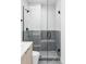 Modern shower with glass enclosure, bench, and stylish tile work, creating a spa-like experience at 425 S Pearl St, Denver, CO 80209