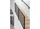 Modern staircase with wooden steps and black railings, complementing the home's contemporary design at 425 S Pearl St, Denver, CO 80209