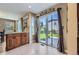 Bright dining area with patio access features wood floors, cabinets and granite countertops at 5090 Miriam Ln, Parker, CO 80134
